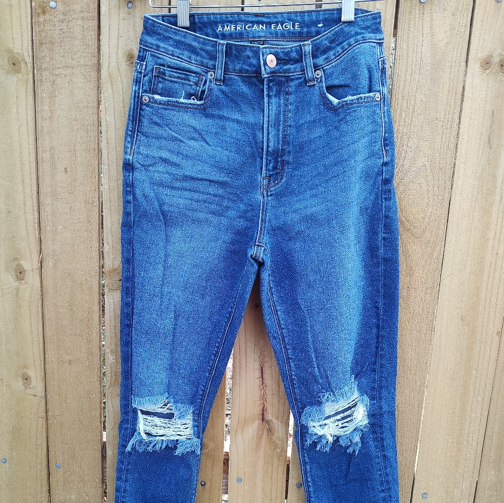 Ladies American Eagle super distressed mom jeans with raw hem size 2